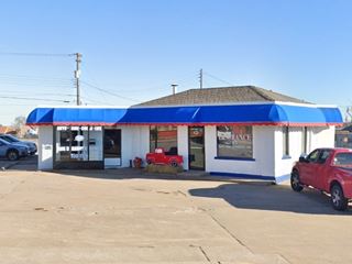 hipped roof brick building on a corner