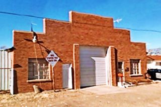 Old garage Adrian red brick garage facade