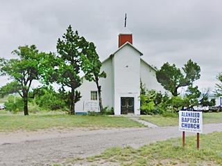hW church with lawn and trees