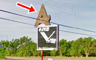 Old 1950s neon sign of Aviatrix Cafe Stylized letter A atop an old faded neons sign