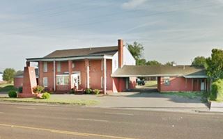 Colonial Manor motel nowadays two story brick gable roof building