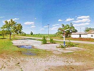 Gulf station site US66 McLean empty lot, concrete apron, foundations