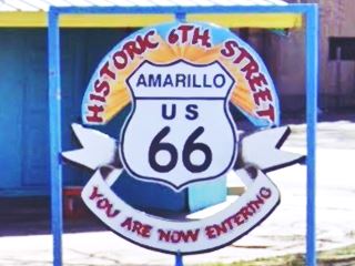 Welcome sign Historic 6th St. district colorful Route 66 road shield with welcome sign