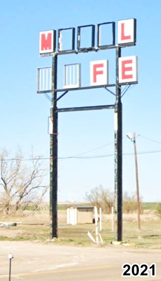 Motel and Cafe sign in Conway, 2021 deteriorated neon sign red letters white background