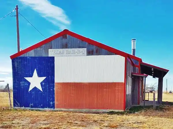 Texan flag painted on the wall of a gabled house